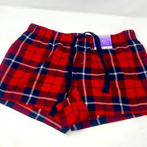 Starts above plaid lounge shorts
